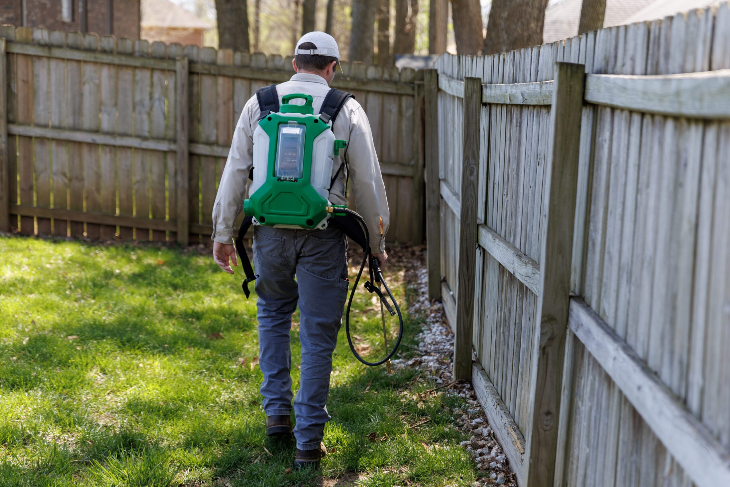 Powell Pest and Lawn outdoor pest treatment Powell Pest and Lawn technician applying an outdoor pest treatment