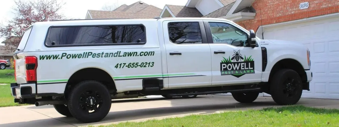 Powell Pest and Lawn Company Vehicle parked at a client's house located in Nixa, MO